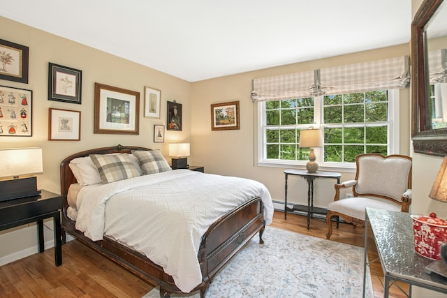 19 Pheasant Ridge Rd, Redding, CT 06896 - bedroom with wood finished floors, baseboards, and baseboard heating