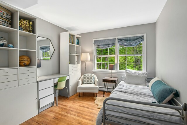19 Pheasant Ridge Rd, Redding, CT 06896 - bedroom with a baseboard radiator and light wood-type flooring