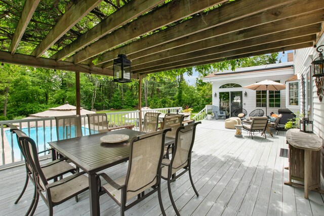 19 Pheasant Ridge Rd, Redding, CT 06896 - deck featuring outdoor dining area, an outdoor pool, a pergola, and view of scattered trees