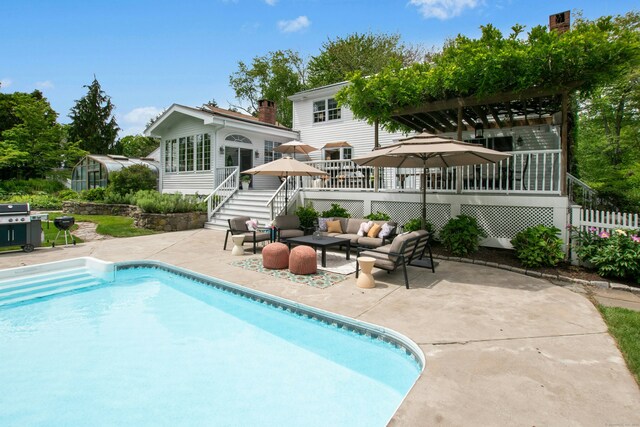 19 Pheasant Ridge Rd, Redding, CT 06896 - back of house with a deck, stairway, an outdoor hangout area, an outdoor pool, and a pergola