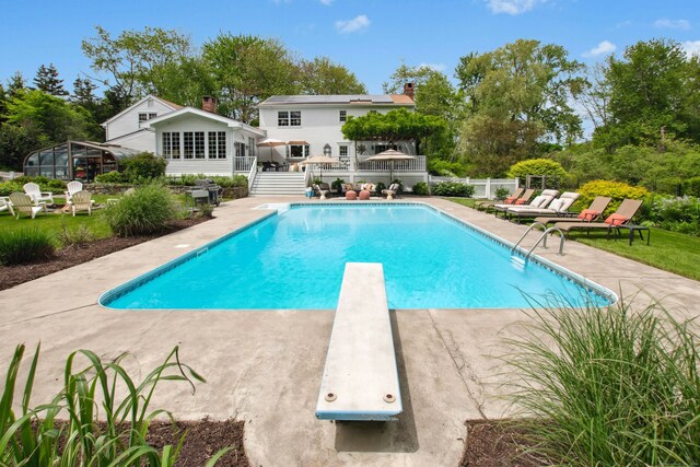 19 Pheasant Ridge Rd, Redding, CT 06896 - swimming pool with a diving board, a patio area, and an outdoor structure