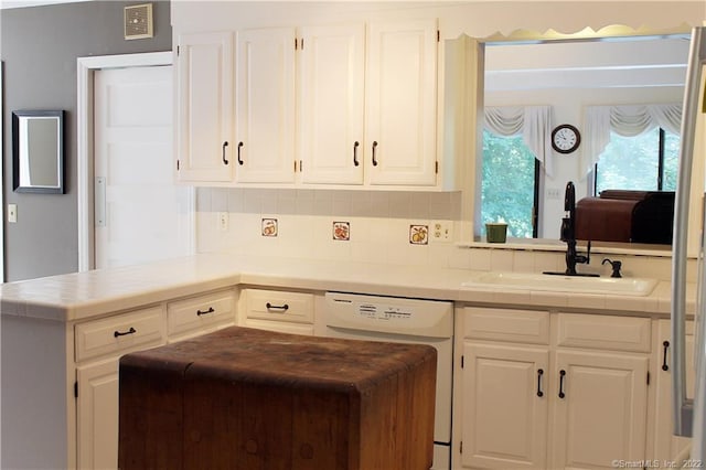 3 Abbey Ln, Shelton, CT 06484 - kitchen featuring white dishwasher, a sink, tile countertops, and white cabinetry