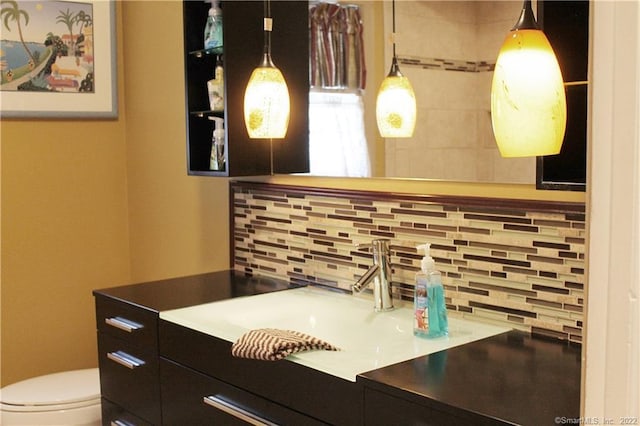 3 Abbey Ln, Shelton, CT 06484 - half bathroom with decorative backsplash, vanity, and toilet
