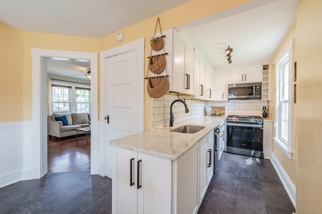 36 Whiton St, Windsor Locks, CT 06096 - kitchen with appliances with stainless steel finishes, open shelves, a sink, white cabinets, and light stone counters
