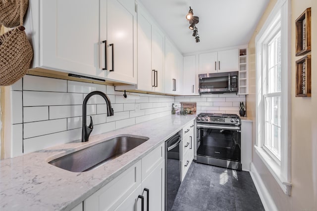 36 Whiton St, Windsor Locks, CT 06096 - kitchen with appliances with stainless steel finishes, a sink, white cabinetry, and decorative backsplash