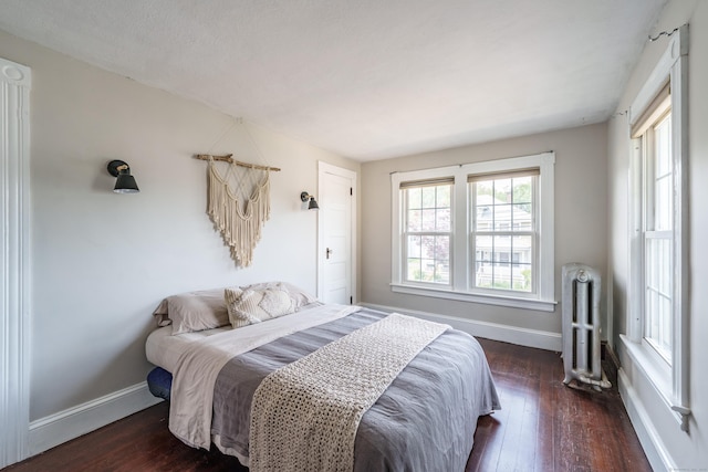 36 Whiton St, Windsor Locks, CT 06096 - bedroom featuring radiator, dark wood-style floors, and baseboards