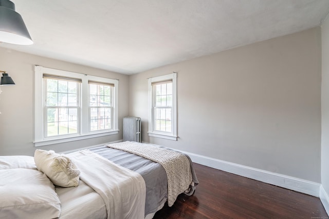 36 Whiton St, Windsor Locks, CT 06096 - bedroom with baseboards, dark wood-style flooring, and radiator heating unit