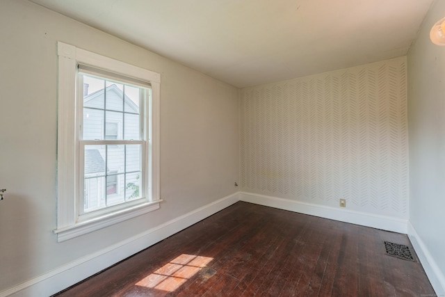 36 Whiton St, Windsor Locks, CT 06096 - spare room with dark wood-style floors, baseboards, plenty of natural light, and wallpapered walls