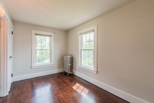 36 Whiton St, Windsor Locks, CT 06096 - spare room featuring radiator heating unit, dark wood-style floors, and baseboards