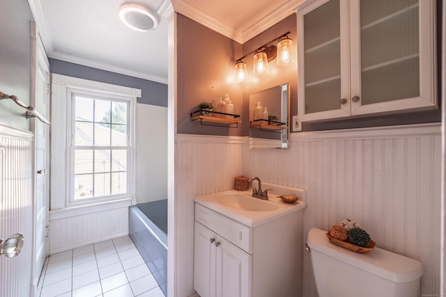 36 Whiton St, Windsor Locks, CT 06096 - bathroom featuring toilet, vanity, a wainscoted wall, tile patterned flooring, and a tub