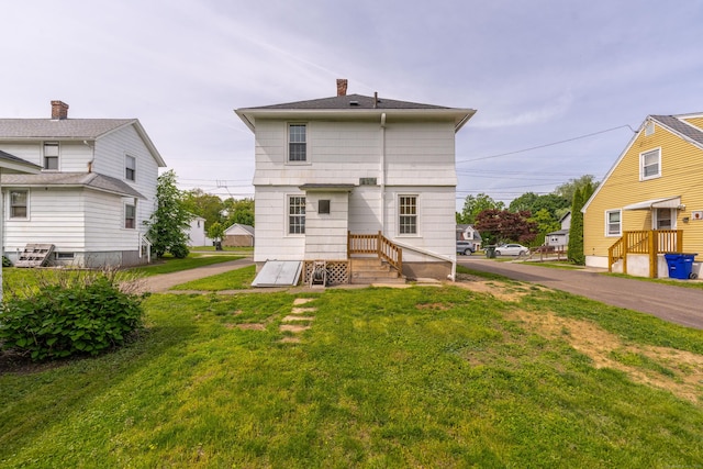 36 Whiton St, Windsor Locks, CT 06096 - rear view of house featuring a lawn