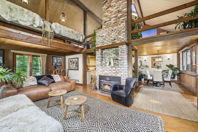 18 Grey Fox Trl, Woodbury, CT 06798 - living room with high vaulted ceiling, wood finished floors, plenty of natural light, wooden ceiling with exposed beams, and baseboards