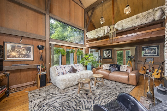18 Grey Fox Trl, Woodbury, CT 06798 - living room featuring high vaulted ceiling, wood walls, hardwood / wood-style flooring, french doors, and wooden ceiling with exposed beams