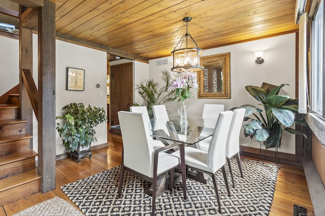 18 Grey Fox Trl, Woodbury, CT 06798 - dining room featuring wood ceiling, a chandelier, stairs, hardwood / wood-style flooring, and baseboards