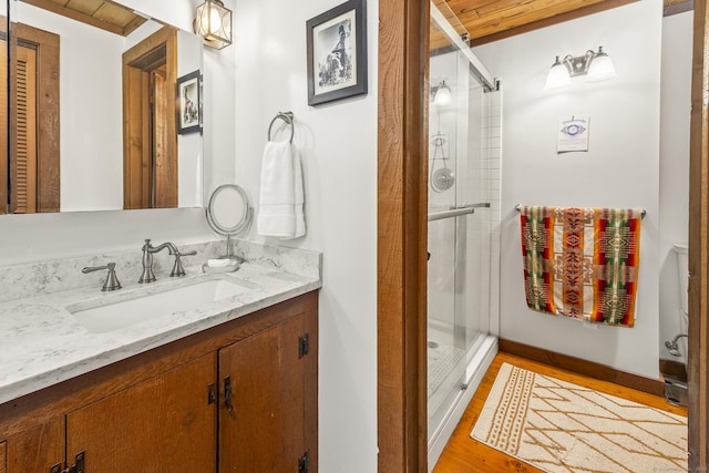 18 Grey Fox Trl, Woodbury, CT 06798 - bathroom featuring vanity, a stall shower, and wood finished floors