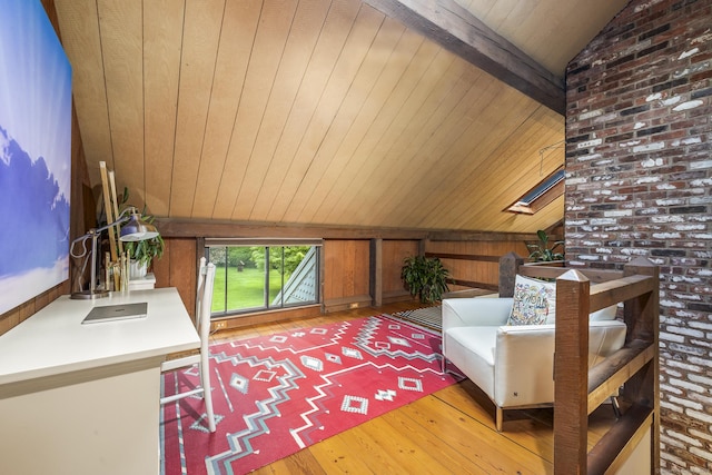 18 Grey Fox Trl, Woodbury, CT 06798 - living area with vaulted ceiling, light wood-style flooring, wooden walls, wood ceiling, and a skylight