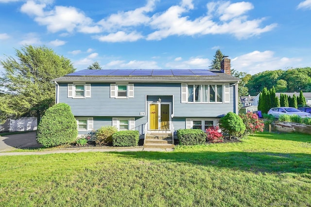 278 High St, Bristol, CT 06010 - bi-level home with a chimney, roof mounted solar panels, and a front yard