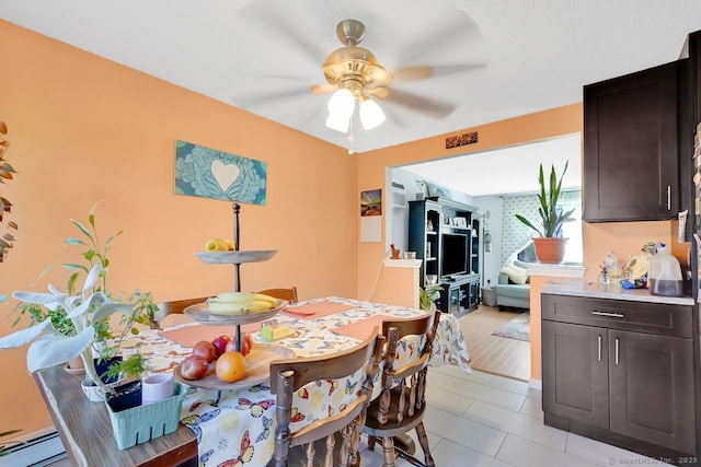 278 High St, Bristol, CT 06010 - dining space featuring ceiling fan, light tile patterned floors, and a baseboard radiator