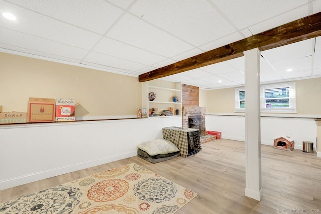 278 High St, Bristol, CT 06010 - sitting room with wood finished floors, baseboards, a fireplace, recessed lighting, and beam ceiling