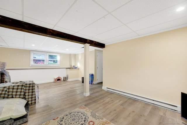 278 High St, Bristol, CT 06010 - below grade area with a baseboard radiator, wood finished floors, baseboards, and recessed lighting