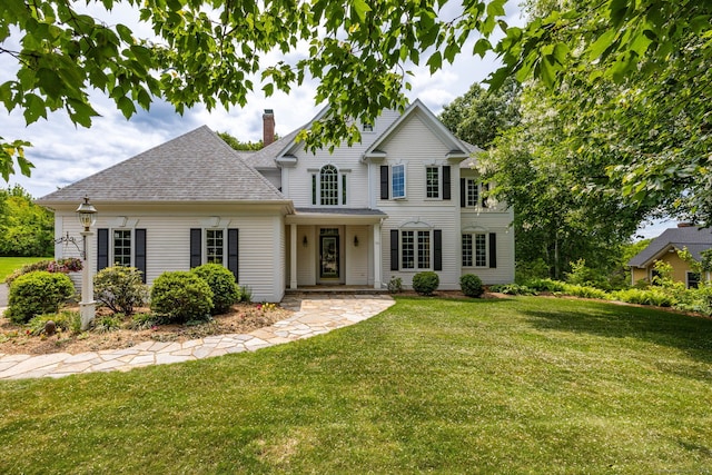 66 Great Pond Rd, Glastonbury, CT 06073 - traditional home with a front yard, a chimney, and a shingled roof