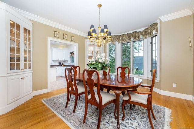 66 Great Pond Rd, Glastonbury, CT 06073 - dining space with a chandelier, light wood finished floors, ornamental molding, and baseboards