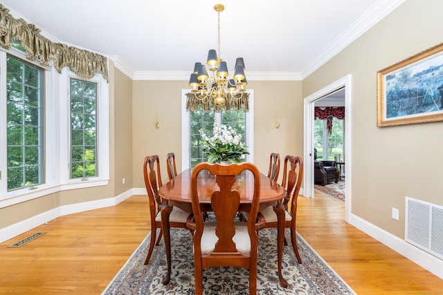 66 Great Pond Rd, Glastonbury, CT 06073 - dining room featuring a chandelier, light wood-type flooring, baseboards, ornamental molding, and plenty of natural light