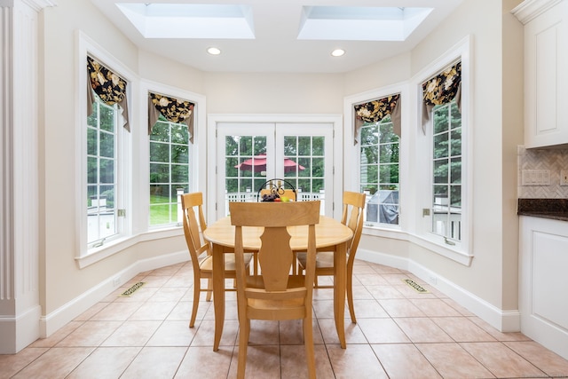 66 Great Pond Rd, Glastonbury, CT 06073 - dining area featuring a skylight, light tile patterned flooring, recessed lighting, and baseboards