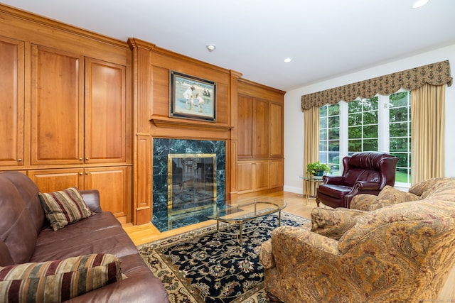 66 Great Pond Rd, Glastonbury, CT 06073 - living area with light wood finished floors, recessed lighting, a high end fireplace, and baseboards