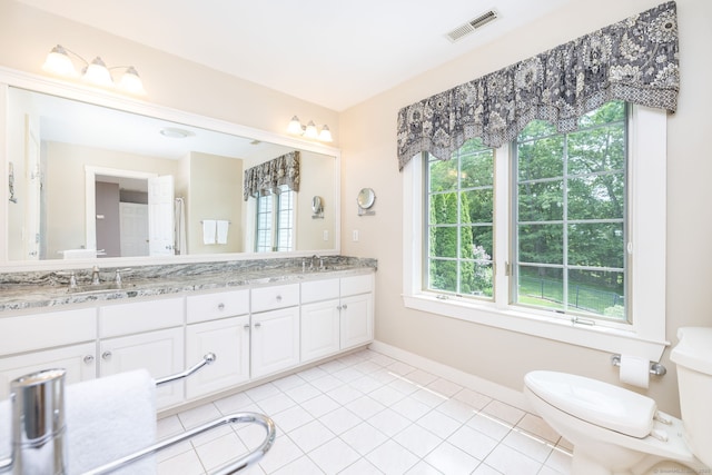 66 Great Pond Rd, Glastonbury, CT 06073 - full bath with toilet, double vanity, tile patterned flooring, and baseboards