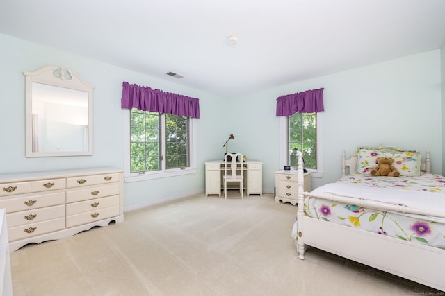 66 Great Pond Rd, Glastonbury, CT 06073 - bedroom featuring multiple windows, light colored carpet, and baseboards