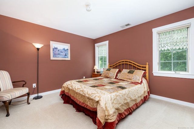 66 Great Pond Rd, Glastonbury, CT 06073 - bedroom featuring light colored carpet, multiple windows, and baseboards