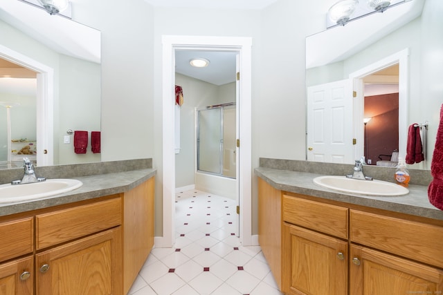66 Great Pond Rd, Glastonbury, CT 06073 - bathroom featuring connected bathroom, a shower with shower door, vanity, and baseboards