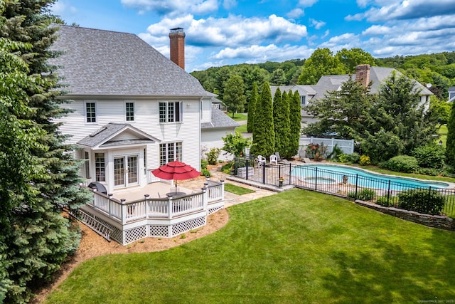 66 Great Pond Rd, Glastonbury, CT 06073 - rear view of house featuring a chimney, a wooden deck, french doors, and roof with shingles