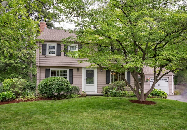 60 Longlane Rd, West Hartford, CT 06117 - colonial-style house with a chimney, driveway, a front lawn, and a garage