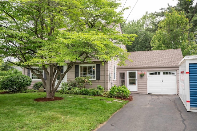 60 Longlane Rd, West Hartford, CT 06117 - view of property hidden behind natural elements with an attached garage, asphalt driveway, a front lawn, and a shingled roof