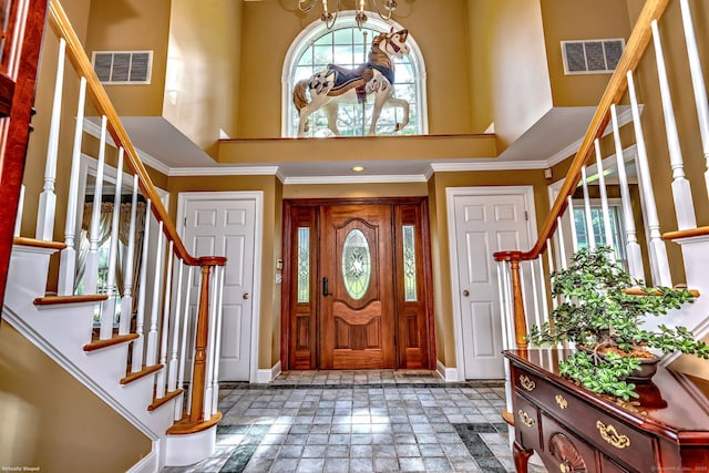 16 Black Rock Tpke, Redding, CT 06896 - entrance foyer featuring stairway, a high ceiling, baseboards, stone tile floors, and ornamental molding