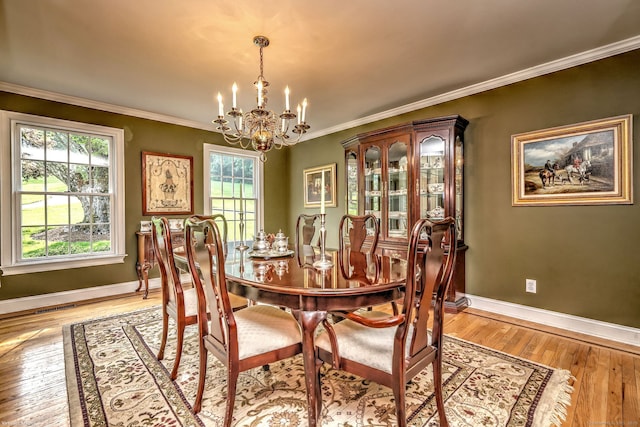 16 Black Rock Tpke, Redding, CT 06896 - dining space featuring a chandelier, healthy amount of natural light, baseboards, light wood-style flooring, and crown molding