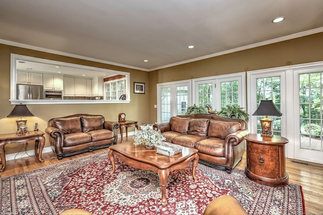 16 Black Rock Tpke, Redding, CT 06896 - living area featuring light wood finished floors, plenty of natural light, recessed lighting, crown molding, and baseboards