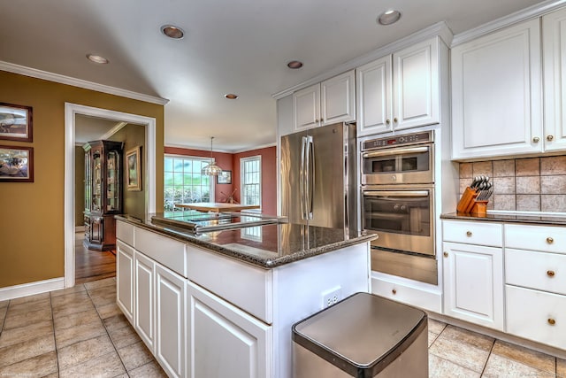 16 Black Rock Tpke, Redding, CT 06896 - kitchen featuring appliances with stainless steel finishes, ornamental molding, a warming drawer, a kitchen island, and tasteful backsplash