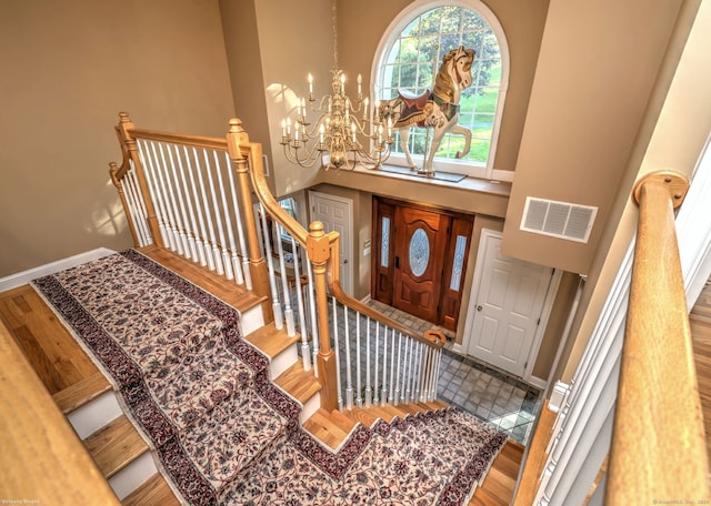 16 Black Rock Tpke, Redding, CT 06896 - entryway with a chandelier, a towering ceiling, wood finished floors, baseboards, and stairs