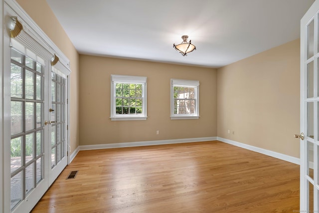 2 Governors Row Unit 2, West Hartford, CT 06117 - unfurnished room featuring french doors, light wood-style flooring, and baseboards