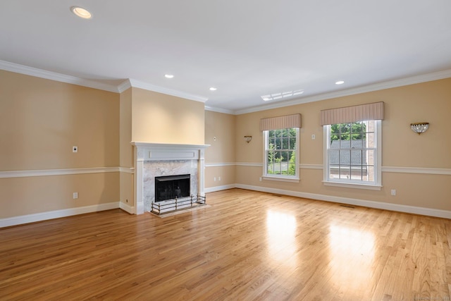 2 Governors Row Unit 2, West Hartford, CT 06117 - unfurnished living room featuring light wood-type flooring, baseboards, a high end fireplace, ornamental molding, and recessed lighting