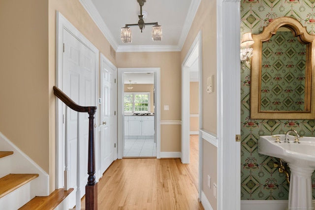 2 Governors Row Unit 2, West Hartford, CT 06117 - foyer featuring stairs, light wood-style flooring, a chandelier, crown molding, and wallpapered walls