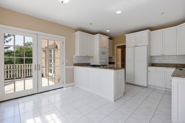 2 Governors Row Unit 2, West Hartford, CT 06117 - kitchen featuring white appliances, french doors, a peninsula, white cabinets, and recessed lighting