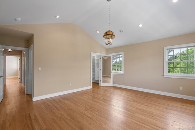 2 Governors Row Unit 2, West Hartford, CT 06117 - spare room featuring plenty of natural light, a chandelier, lofted ceiling, baseboards, and recessed lighting