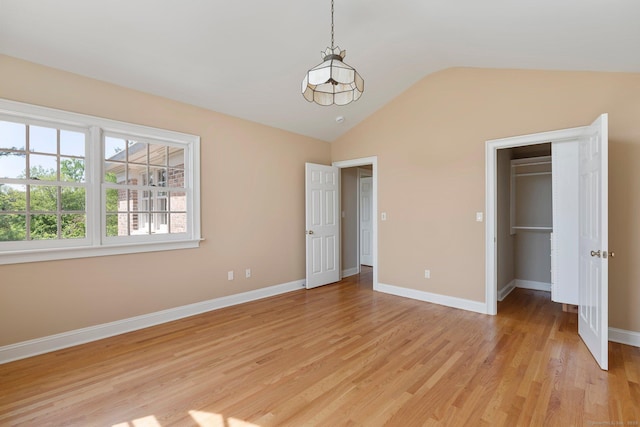 2 Governors Row Unit 2, West Hartford, CT 06117 - unfurnished bedroom featuring lofted ceiling, light wood-style floors, baseboards, a spacious closet, and a closet
