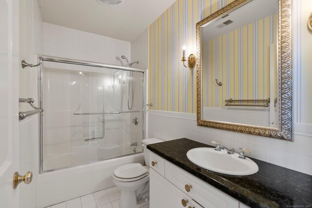 2 Governors Row Unit 2, West Hartford, CT 06117 - full bath featuring vanity, toilet, bath / shower combo with glass door, wallpapered walls, and tile patterned floors