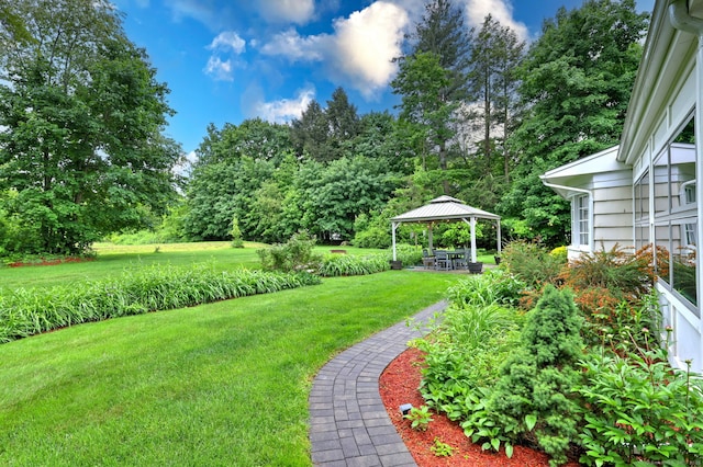 691 Buttonball Rd, Orange, CT 06477 - view of green lawn featuring a gazebo and view of wooded area