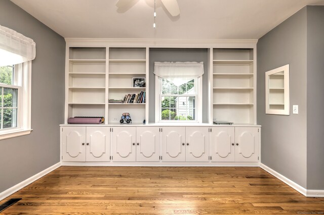 691 Buttonball Rd, Orange, CT 06477 - empty room featuring plenty of natural light, light wood-style floors, baseboards, and a ceiling fan